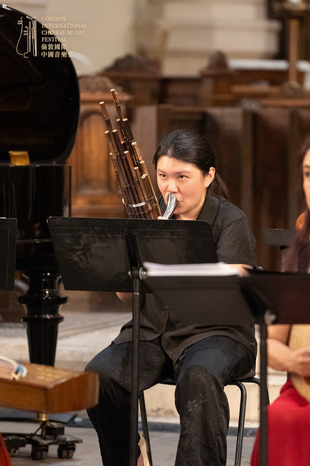 Julia performing on sheng at the London International Chinese Music Festival